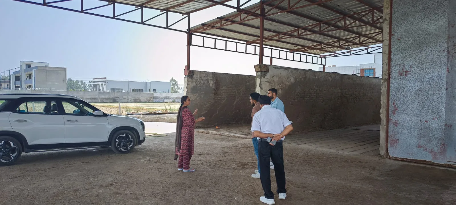 Trainees in an interactive discussion during a farm visit workshop