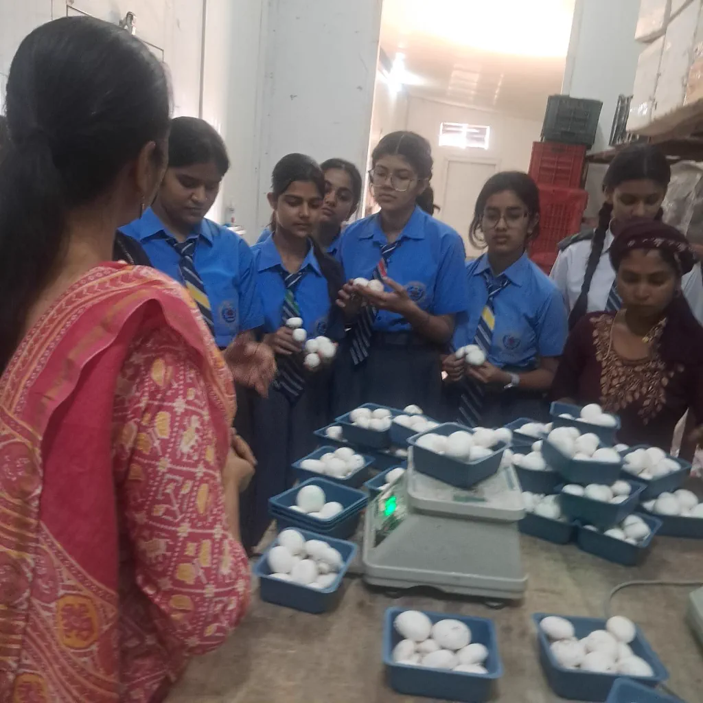 Students learning mushroom packing process at Dr. Dahiya Farms